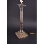 A large silver plated Corinthian column lamp on a stepped base, with the maker's mark for Walker &