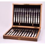 A cased set of 12 Victorian silver plate and mother of pearl handled dessert knifes and forks in a