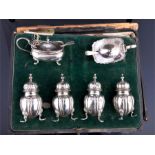 A Mappin and Webb six piece silver cruet set hallmarked Birmingham 1915, comprising four pepperettes