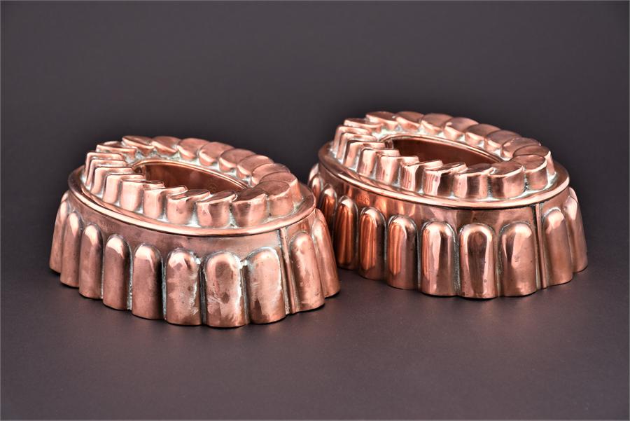 A pair of Victorian 'coin top' jelly moulds, of oval form bearing makers mark for Henry