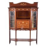 An Edwardian Art Nouveau mahogany display cabinet the upper gallery inlaid with mother of pearl