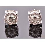 A pair of 18 carat white gold and circular cluster earrings each set round cut diamond surrounded by