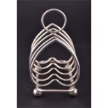 A small Victorian silver heart-shaped four division toast rack hallmarked Birmingham 1898, weight