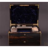 A Victorian coromandel dressing table box by Asprey of London the brass bound body with inset