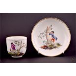 A rare 18th century Fulda porcelain cup and saucer the cup painted with a scene of a traveller in