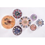 A collection of various glass paperweights, to include several millefiori examples, a Caithness '
