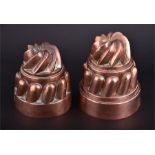 Two Victorian copper jelly moulds of spiral design and circular form no. 249, orb and cross marks of