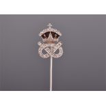 An unusual 18ct white gold and diamond tie pin in the form of a crown above an entwined diamond