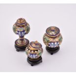 Three miniature 20th century lidded Chinese cloisonné vases  with floral decoration, each on its own