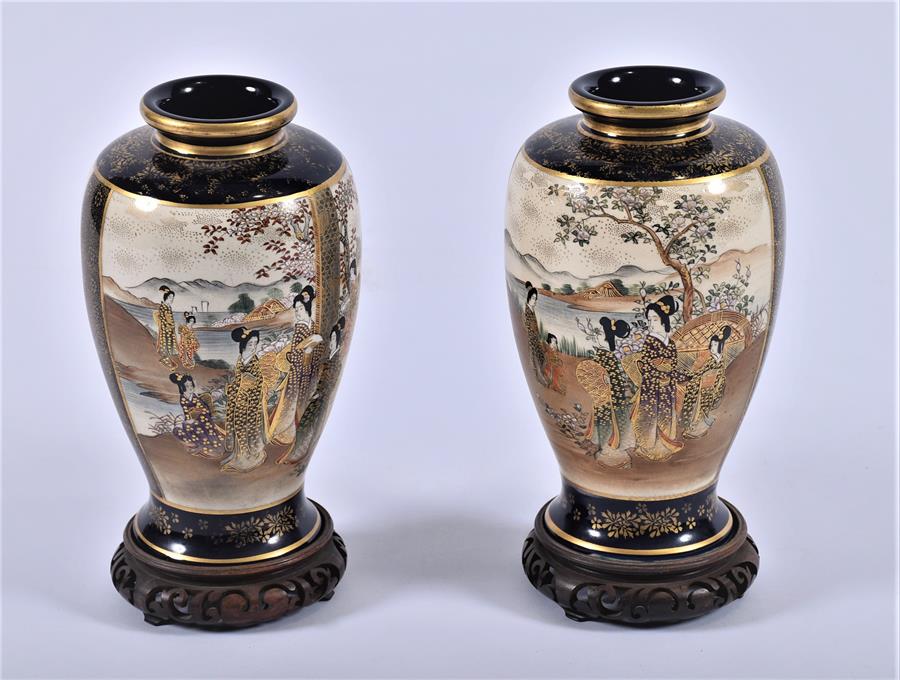 A pair of Japanese Satsuma vases c.1900  decorated with scenes of families in mountainous