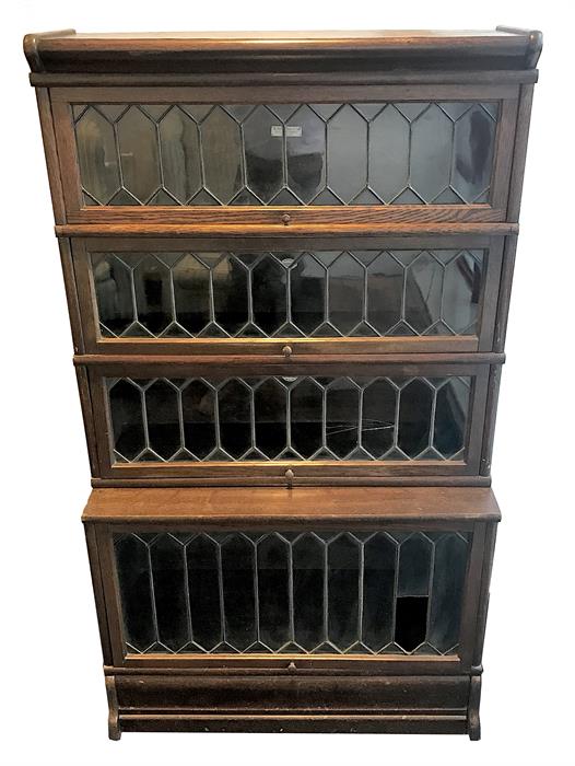 An early 20th century oak four-section Globe Wernicke bookcase  the top section by Globe Wernicke,