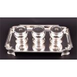 A George V silver inkstand  London 1935, Crichton Brothers, the shaped rectangular body with