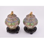 A pair of 20th century lidded Chinese cloisonné vases  with ornate floral decoration and a gilt