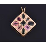 A yellow metal and tourmaline pendant the diamond shaped mount with bark effect, and set with nine