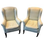 A pair of 19th century winged armchairs upholstered in green striped damask fabric, with square