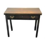 A George III rectangular oak tea table  the fold-over top above a frieze drawer, on square chamfered