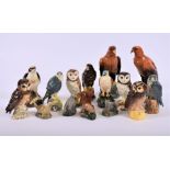 A collection of 15 Royal Doulton and Beswick whisky bottles  in the form of birds, some complete