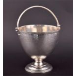 A Victorian silver sugar basket  London 1864, by Edward & John Barnard, the ovoid body with bright-