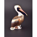 A 1998 Royal Crown Derby brown pelican paperweight  with white metal stopper stamped with the