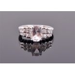 A 9ct white gold and morganite ring centered with an oval cut pink morganite of approximately 1.70