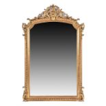 A large Victorian gilt gesso over mantel wall mirror  with scrolled floral surmount, the finely