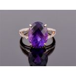 A quality 9ct yellow gold, diamond and amethyst ring set with an unusually brightly coloured faceted