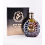 A bottle of Remy Martini Extra Fine Champagne Cognac unopened and in original box. CONDITION