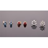 Three pairs of gemstone set earrings to include a pair of 9ct yellow gold and trillion cut pink