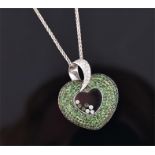 A bespoke 18ct white gold, diamond and demantoid garnet pendant the mount set with round cut