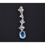 A 9ct yellow gold and blue topaz articulated drop pendant with four topaz and diamond accent