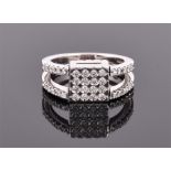 An unusual 18ct white gold and diamond metamorphic ring comprising of reversible square mount, one