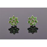 A pair of yellow gold and demantoid garnet floral cluster ear studs each set with eight round cut