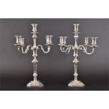 A large pair of silver candelabras  Sheffield 1995, by C.J Vander Ltd, each central baluster