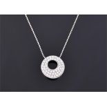 An 18ct white gold and diamond pendant of circular form, pave set with round cut diamonds,