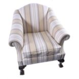 An upholstered armchair  with deep seat, rolled arms and striped contemporary upholstery,