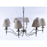 A pair of substantial contemporary eight-branch chrome plated chandeliers with swept arms and