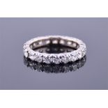 A diamond eternity ring set with twenty round brilliant cut diamonds of approximately 3.20cts