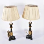 A pair of Classical Revival cast bronze desk lamps the tapered fluted columns with gilt acanthus