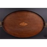 An Edwardian mahogany butler's tray of oval form, with raised gallery, central satinwood shell inlay