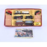 A Marklin train set, boxed containing various engines, carriages, and a Marklin booklet, together