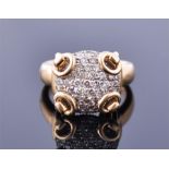 A Gucci 18ct yellow gold and diamond ring the circular pave set diamond mount with four gold rings