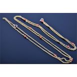 A Victorian yellow gold muff chain the rope-twist chain interspersed with rounded coral beads,