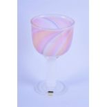 A Bengt Edenfalk for Kosta Boda glass goblet decorated in pastel pink, orange, blue and opal