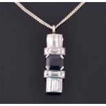 A diamond and sapphire Art Deco style pendant centred with a square cut sapphire of approximately
