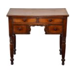 A Georgian mahogany dressing desk of small proportions two long and two short drawers divided by a