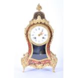 A late 19th Century French boulle tortoiseshell mantel clock  of balloon form with ormolu mounts.