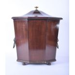 A Georgian mahogany octagonal wine cooler the hinged lid with brass finial, tapered sides, supported