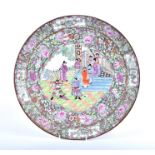 A large Cantonese Charger with a multi-figure narrative scene at the centre, gilt and floral
