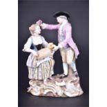 A 19th century Meissen porcelain group of a shepherdess and gentleman the gentleman wearing a pink