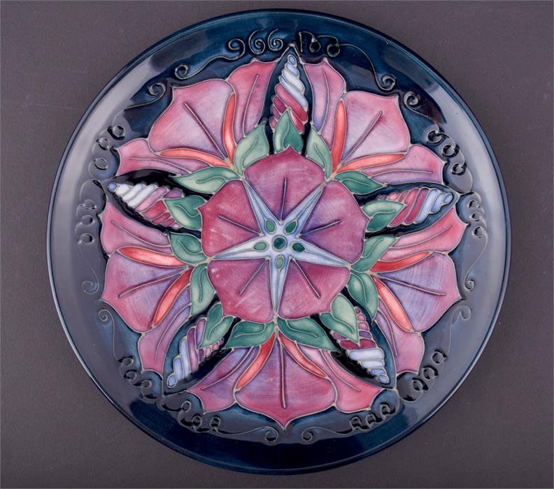 A Moorcroft Morning Glory plate 1996, signed and numbered 427/500 to base, in its original box